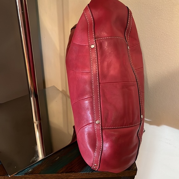 Fossil cranberry pink color, great leather bag
